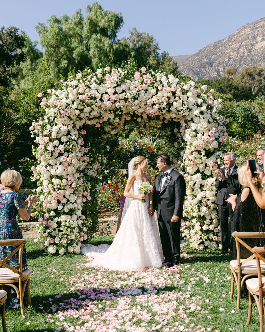 Vows beneath the rose arch
