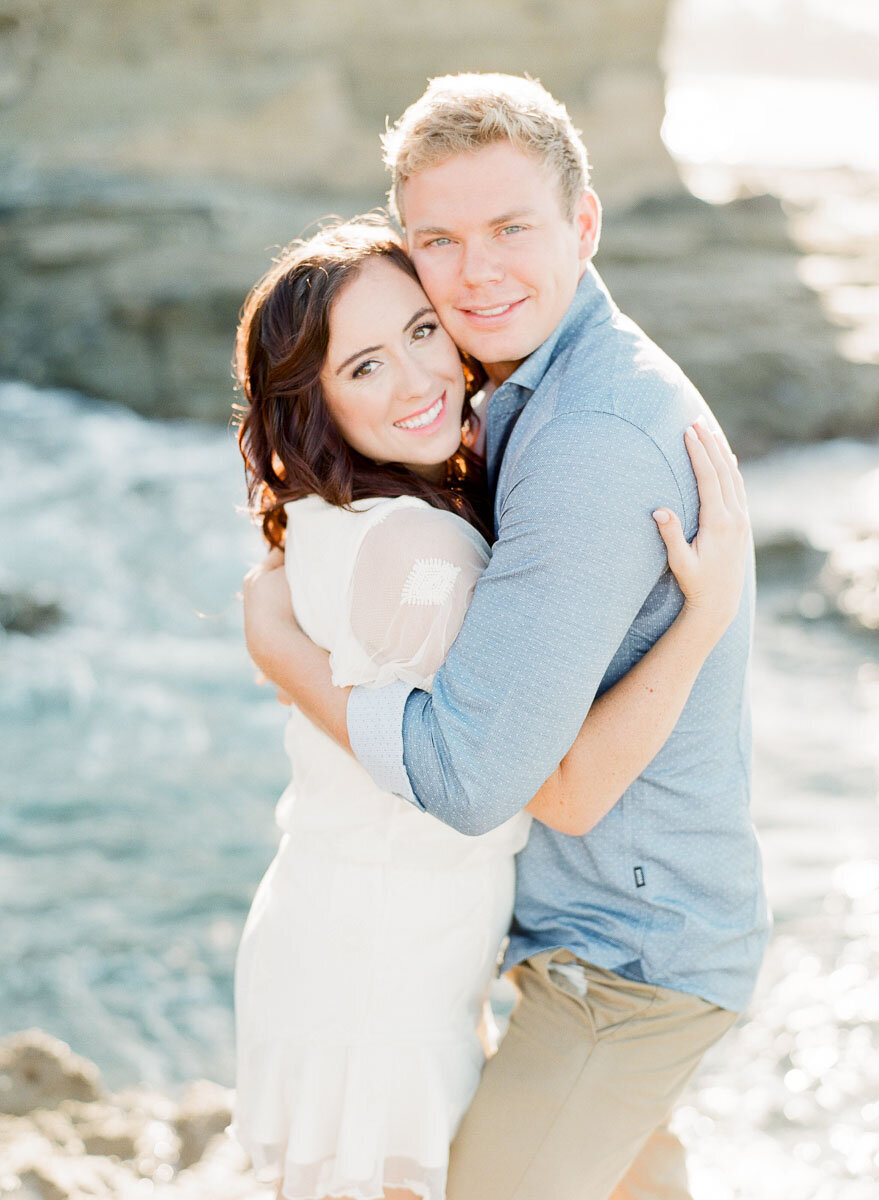 Cheek to cheek in the cove, surf breaking behind