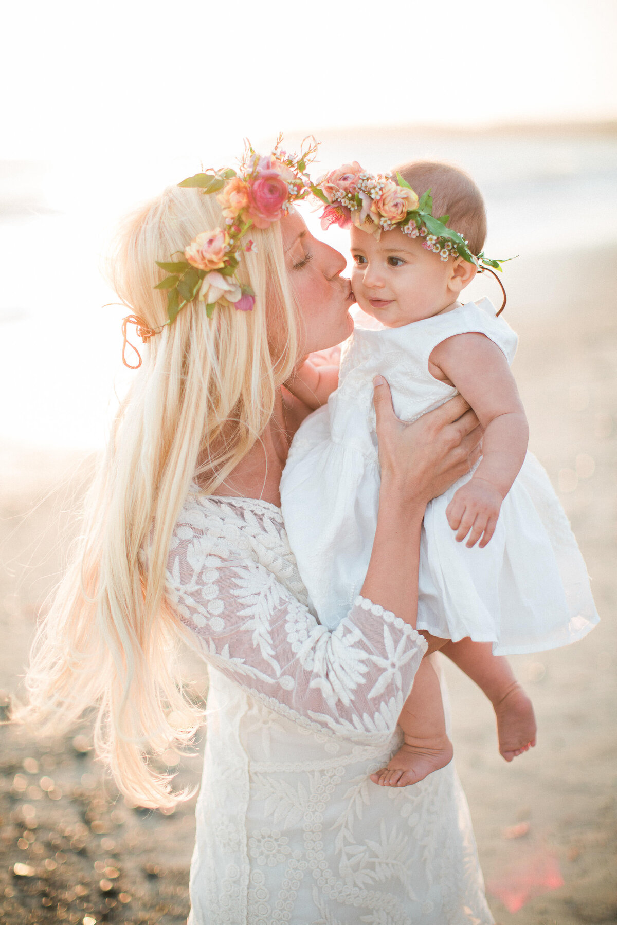 Flower crowns for mother and daughter in the last beach light