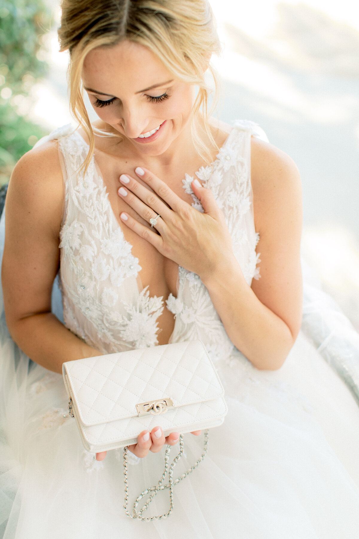 Her quilted clutch in hand, the ring catching the light