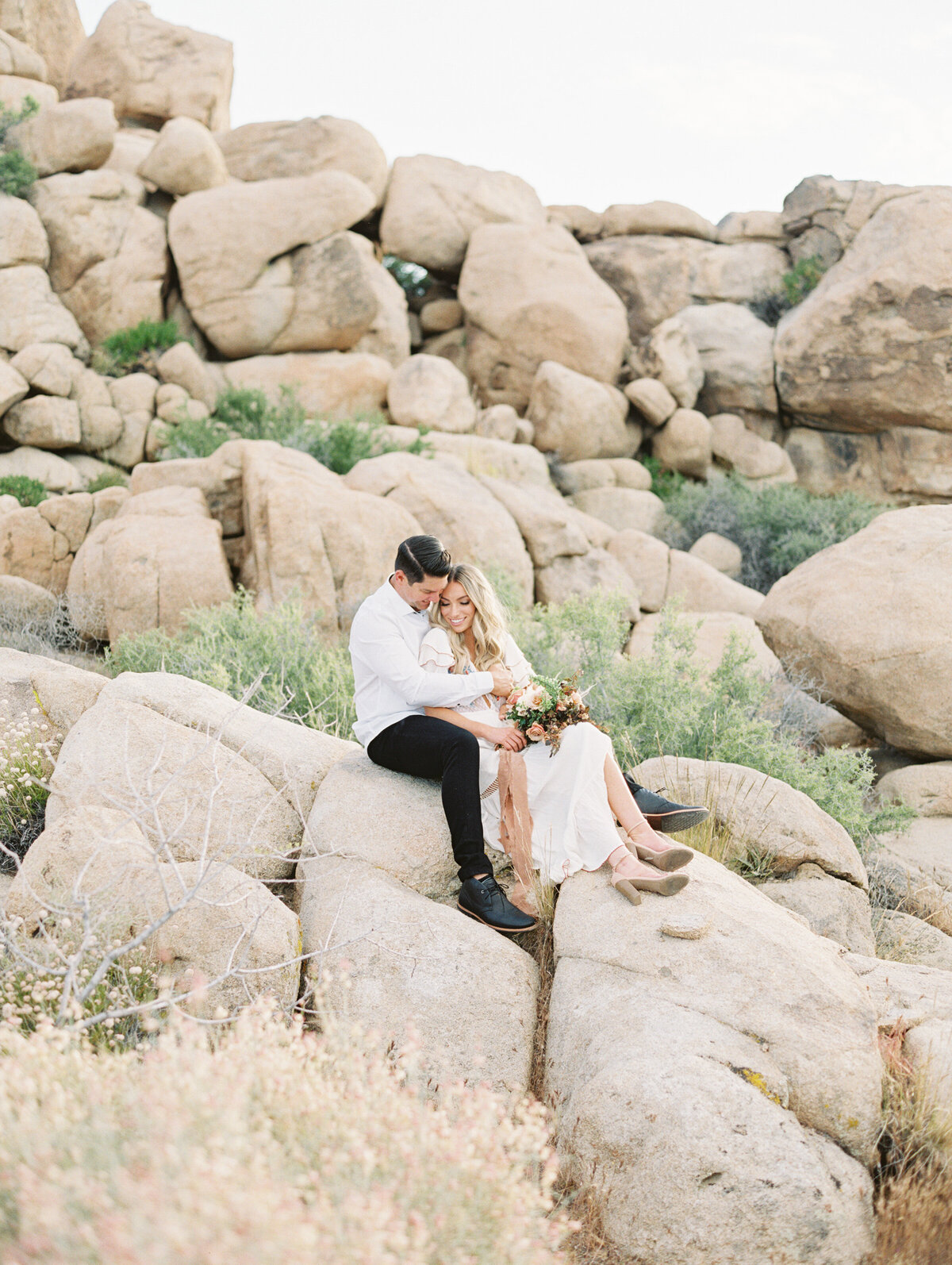 Settled into the boulders, her heels already off