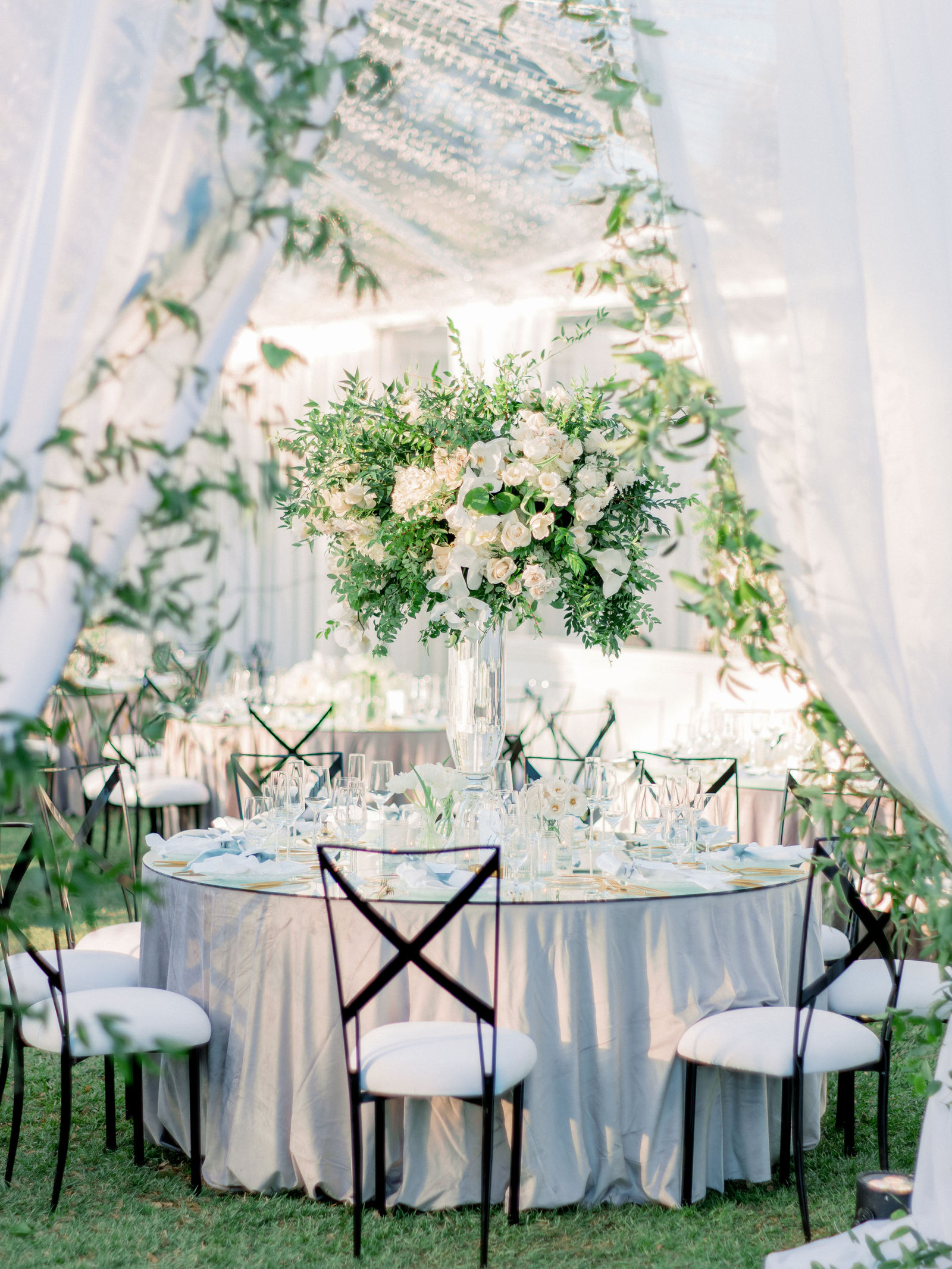 White florals over the reception arch