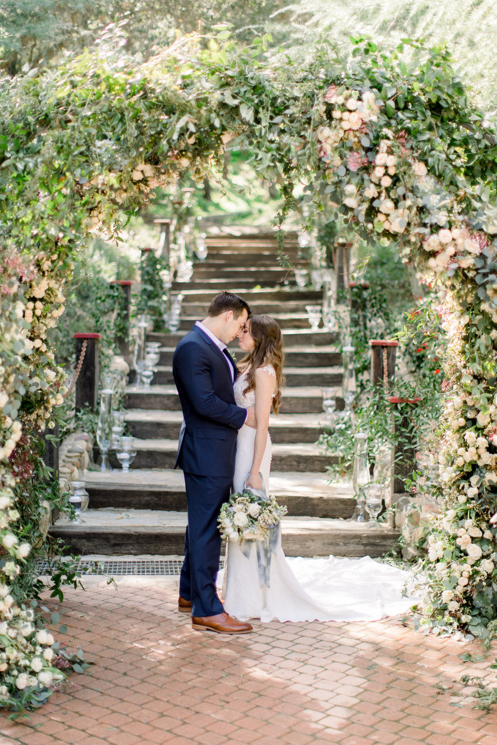 The couple in the flower-covered stairway