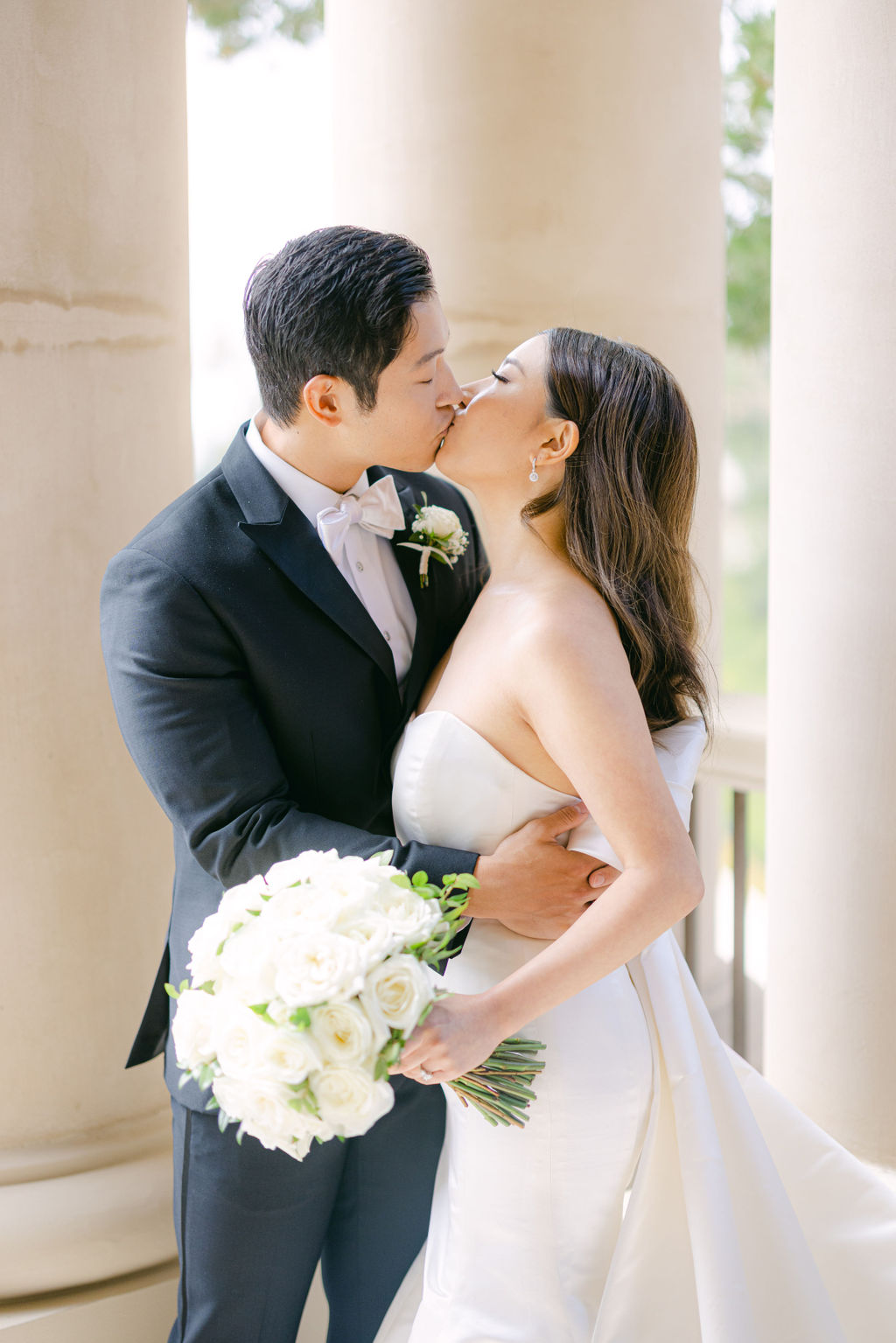 A kiss on the colonnade at The Resort at Pelican Hill