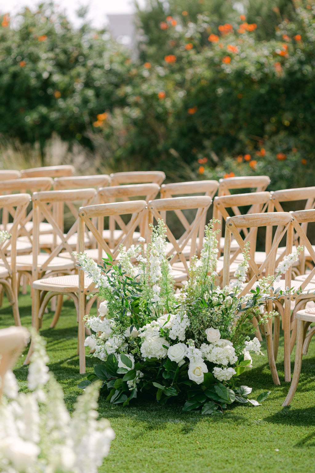 Ceremony chairs and white floral meadows at Catalina Point