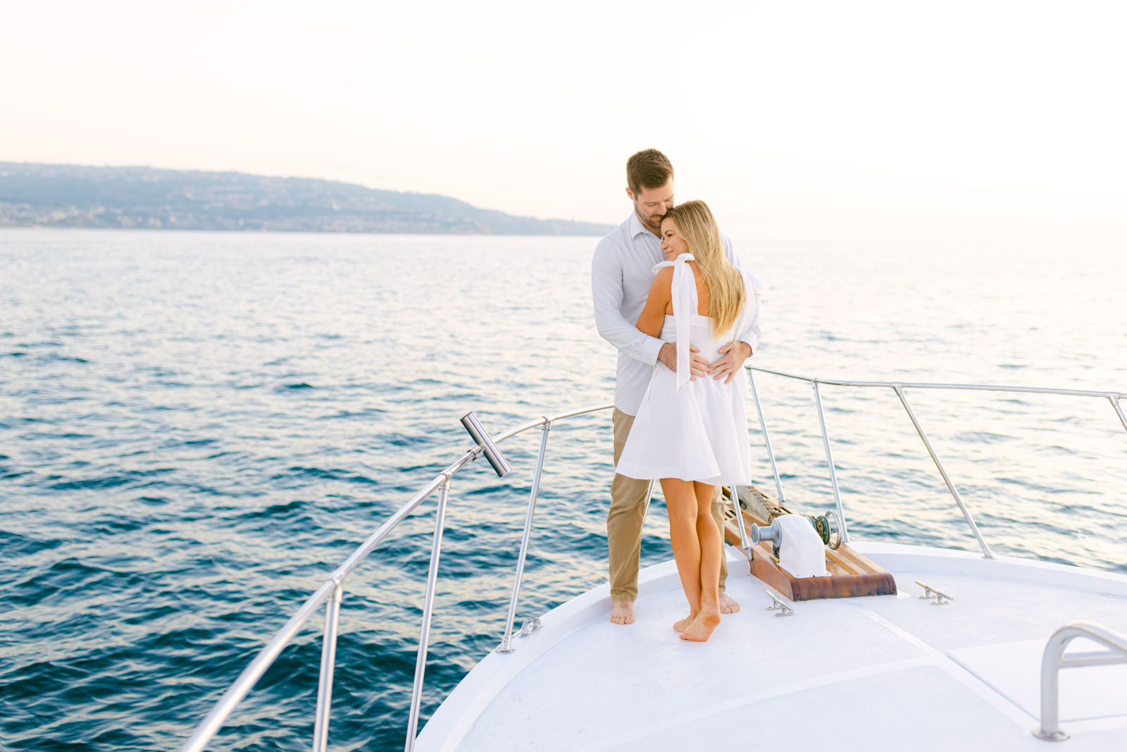 An embrace on the bow off the Palos Verdes coast at golden hour