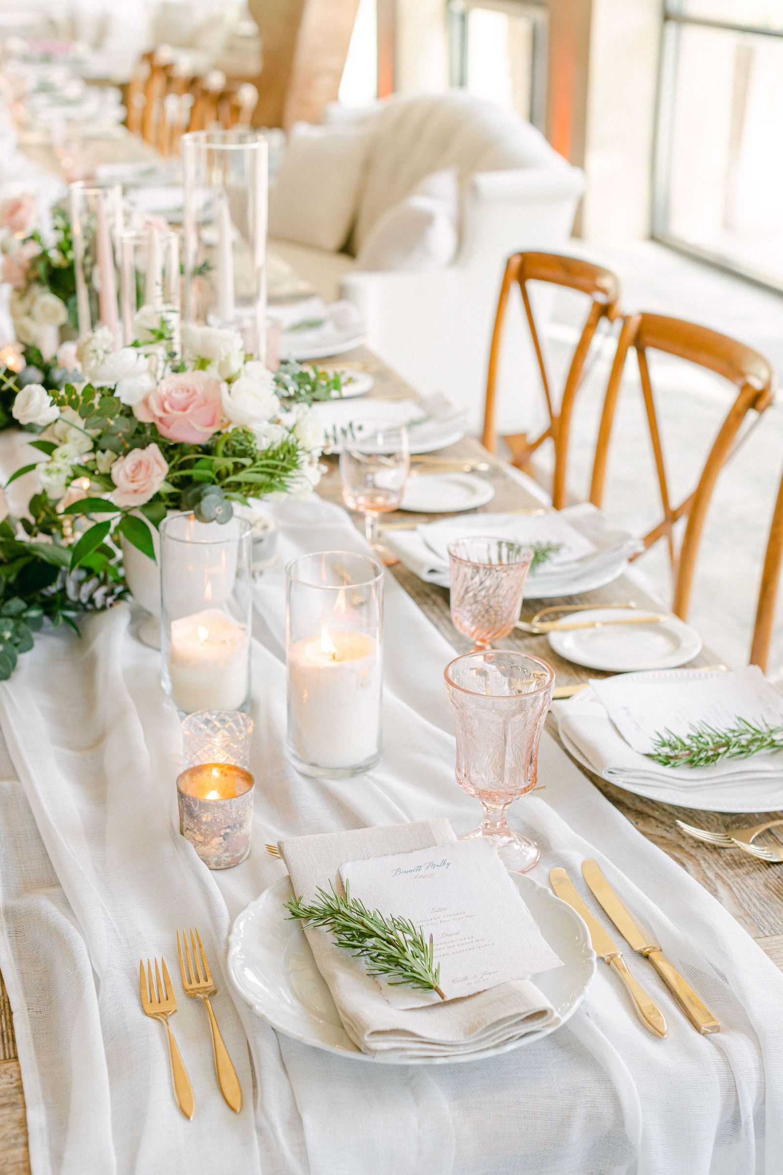 Candlelight and greenery down the reception table