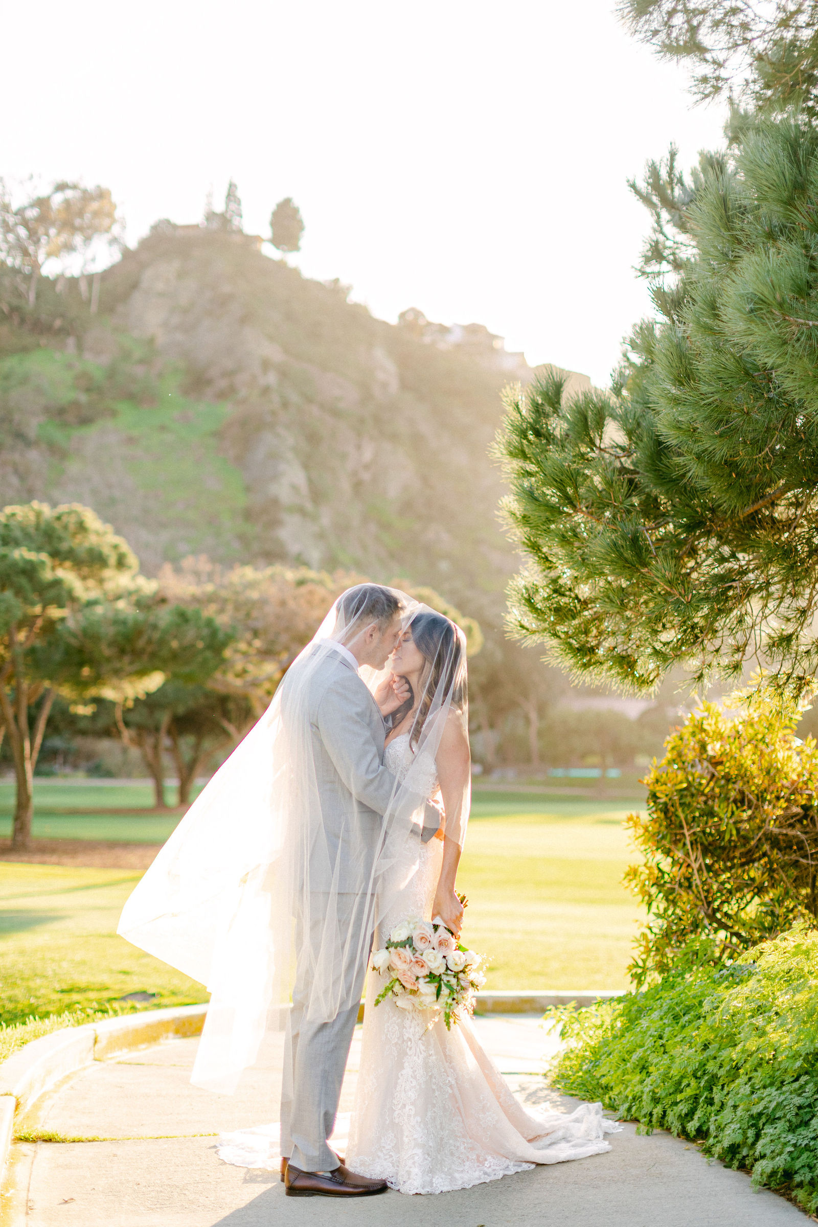 A kiss beneath the trees