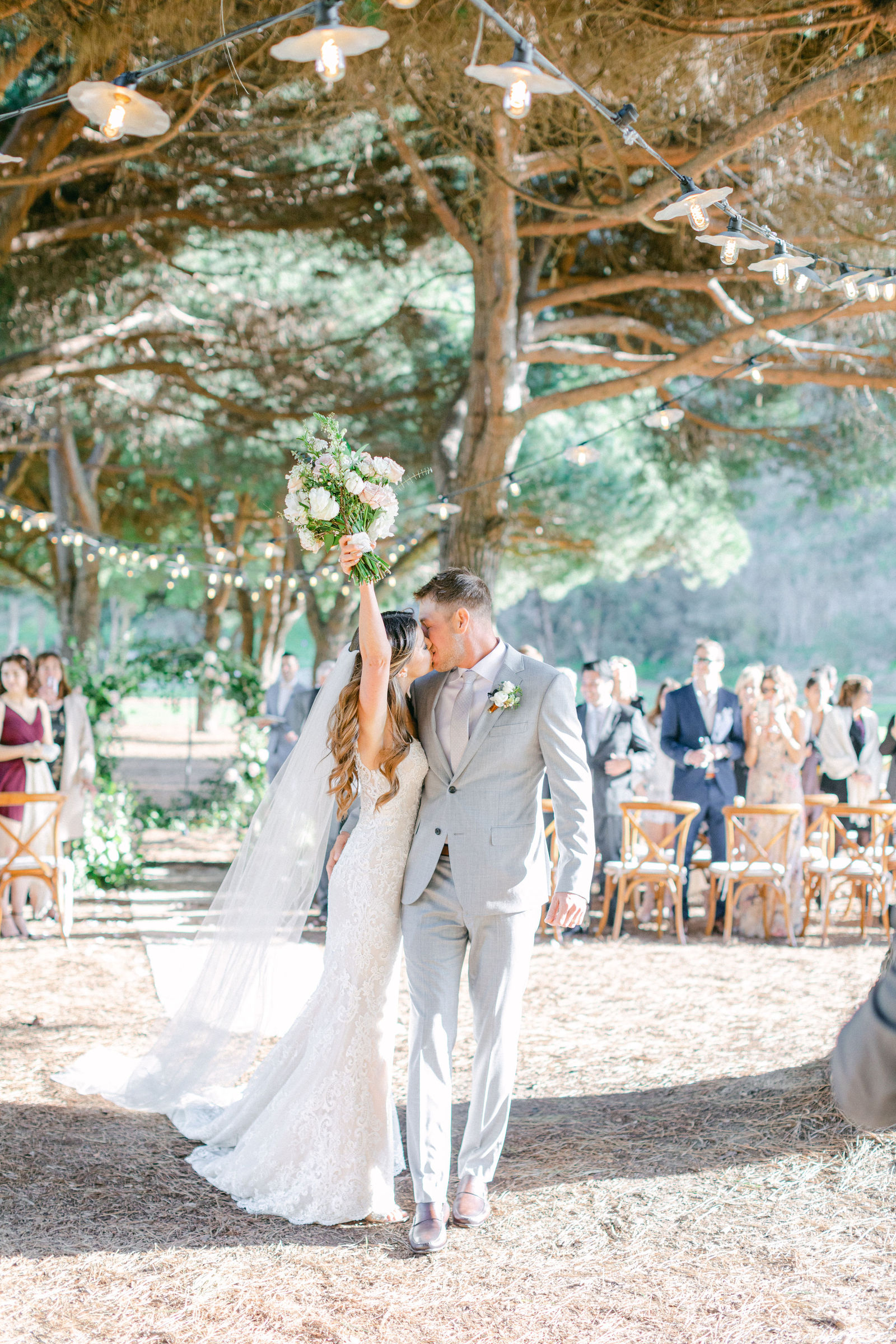 The recessional, arms up, guests on their feet