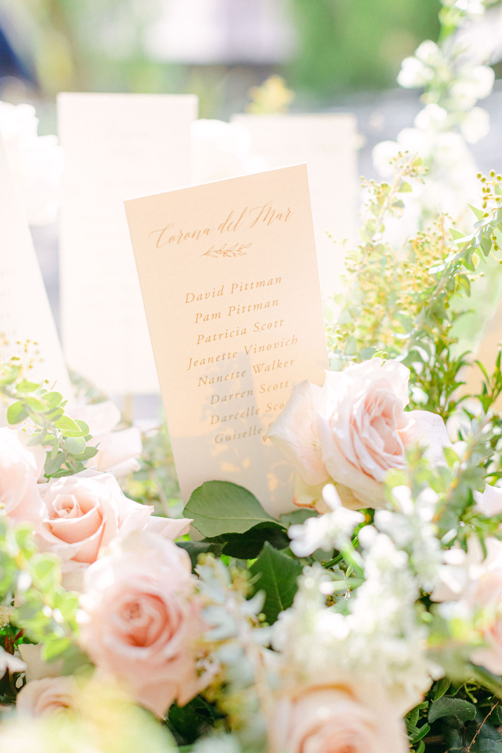 Details from the day: the menu, rolled towels, a basket of blooms