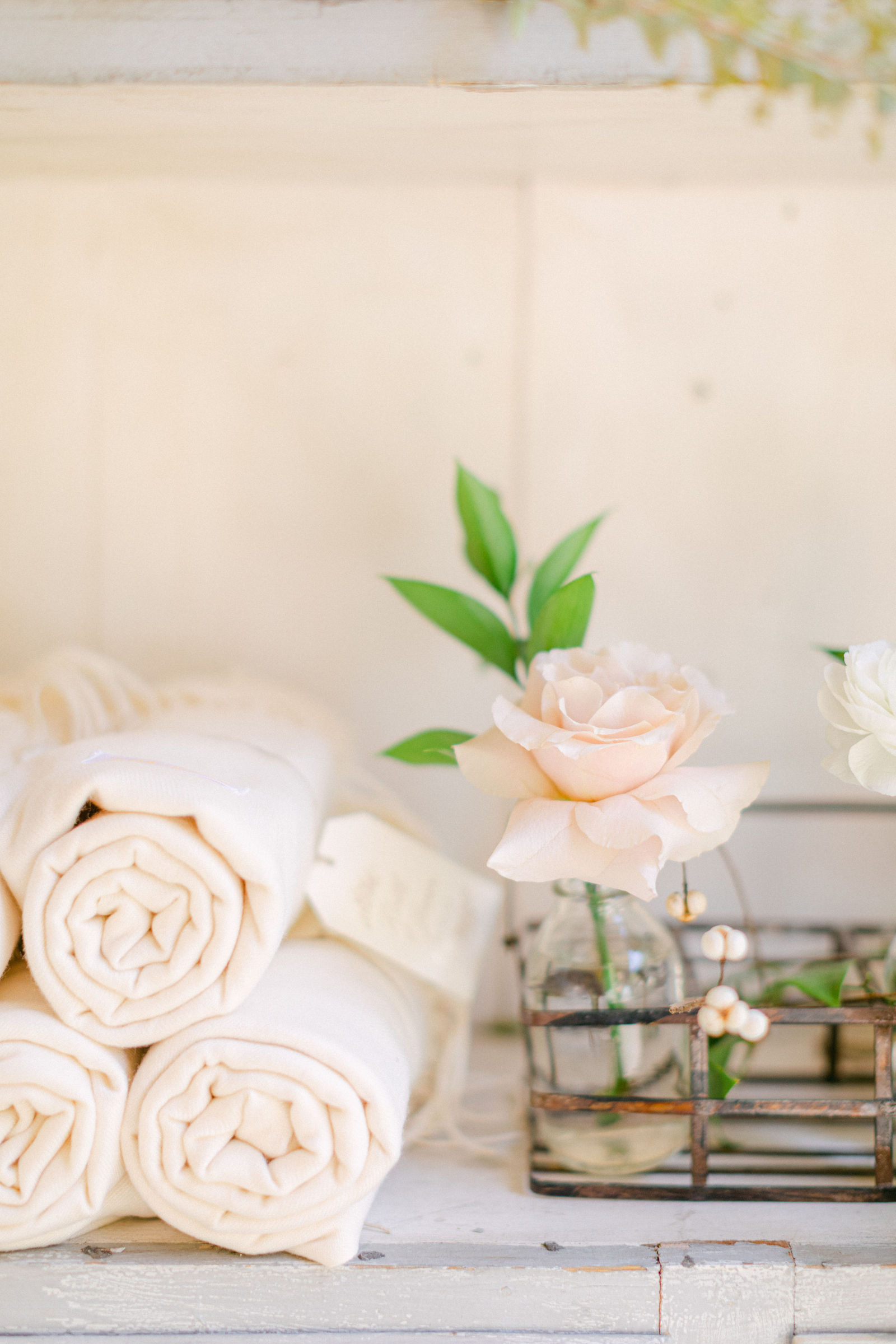 Details from the day: the menu, rolled towels, a basket of blooms
