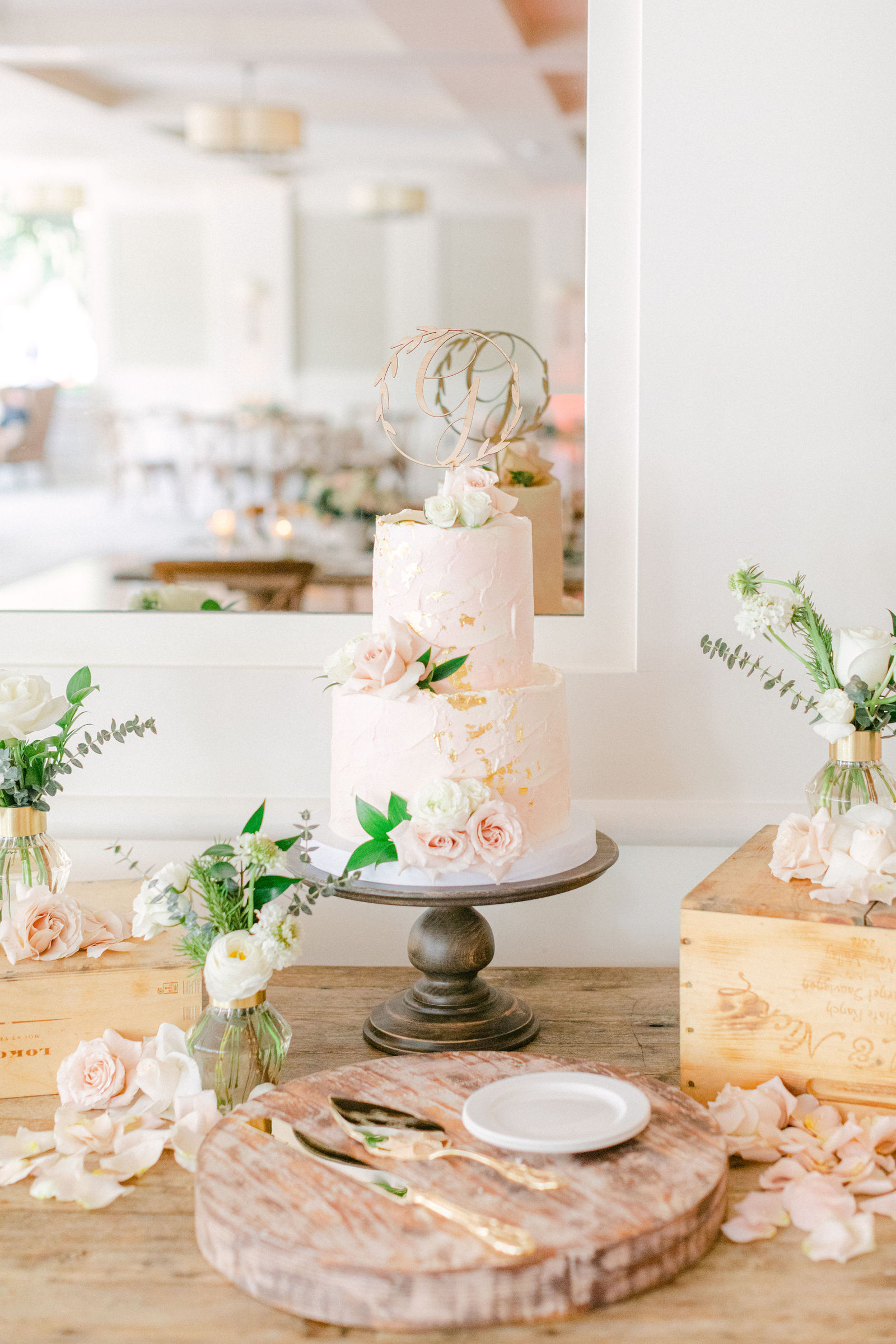The wedding cake with a monogram topper