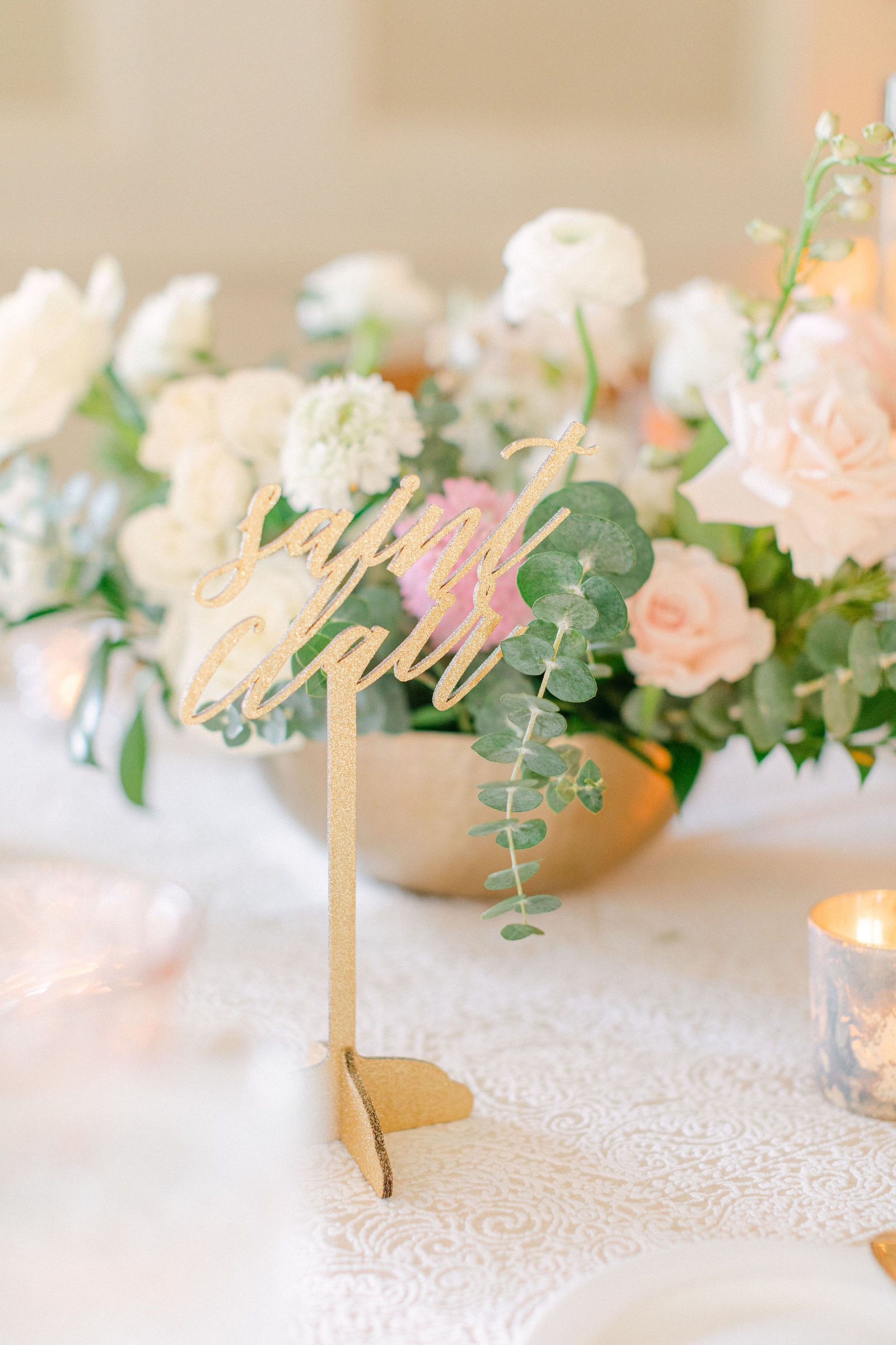 Grazing boards and low bowls of blush roses at cocktail hour