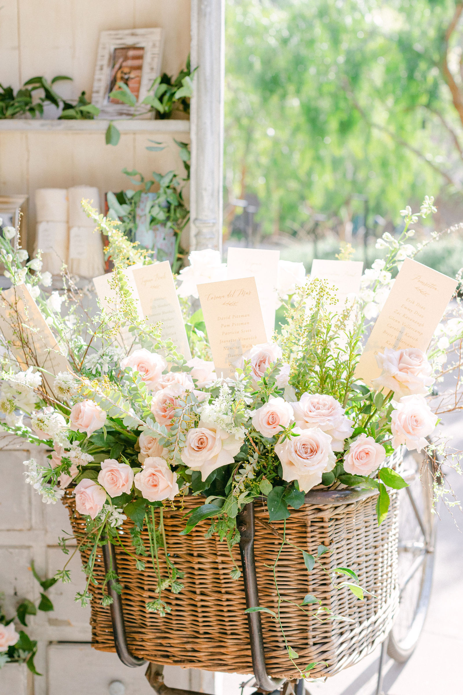 Details from the day: the menu, rolled towels, a basket of blooms