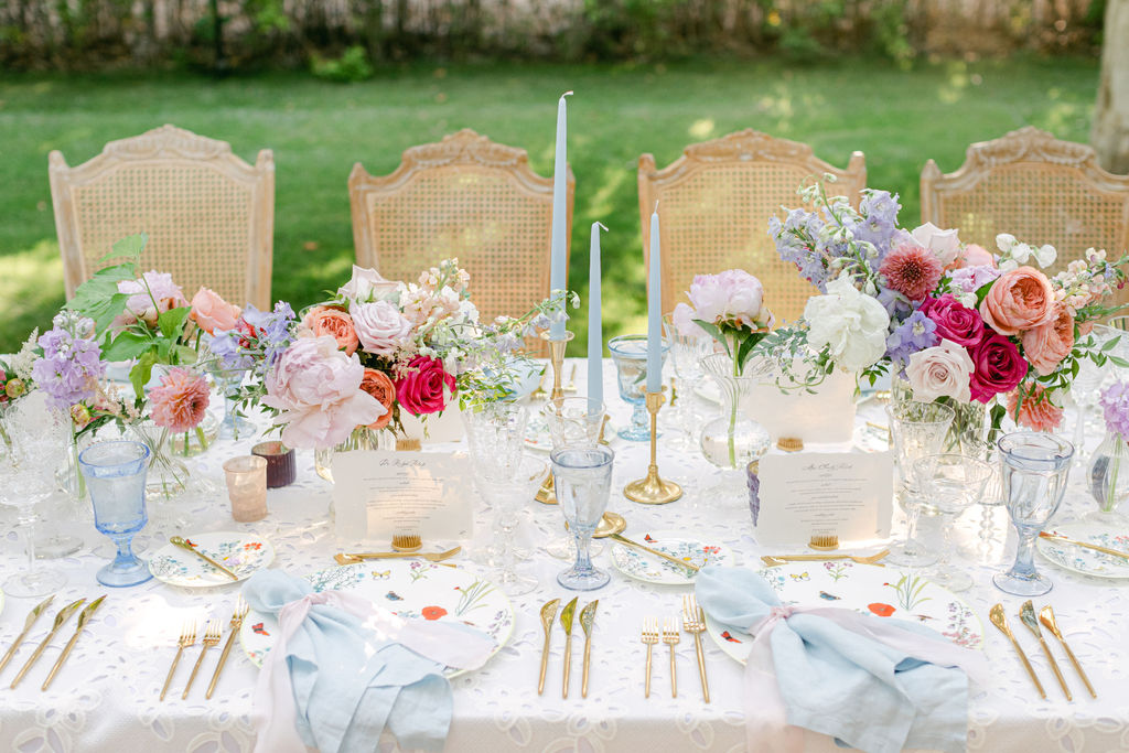 Cane chairs and a full summer tablescape in the allee