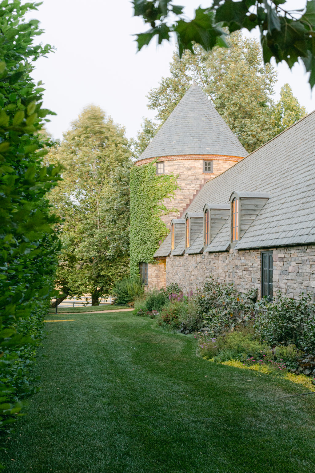 Ivy-covered stone barn at Kestrel Park