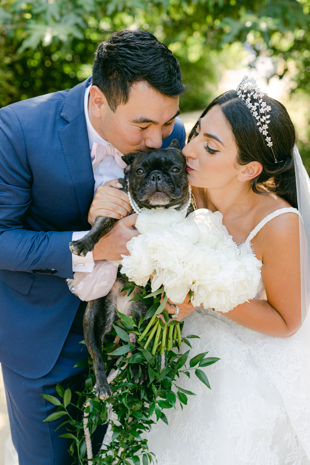 Julia and Maxwell with their French bulldog after the ceremony