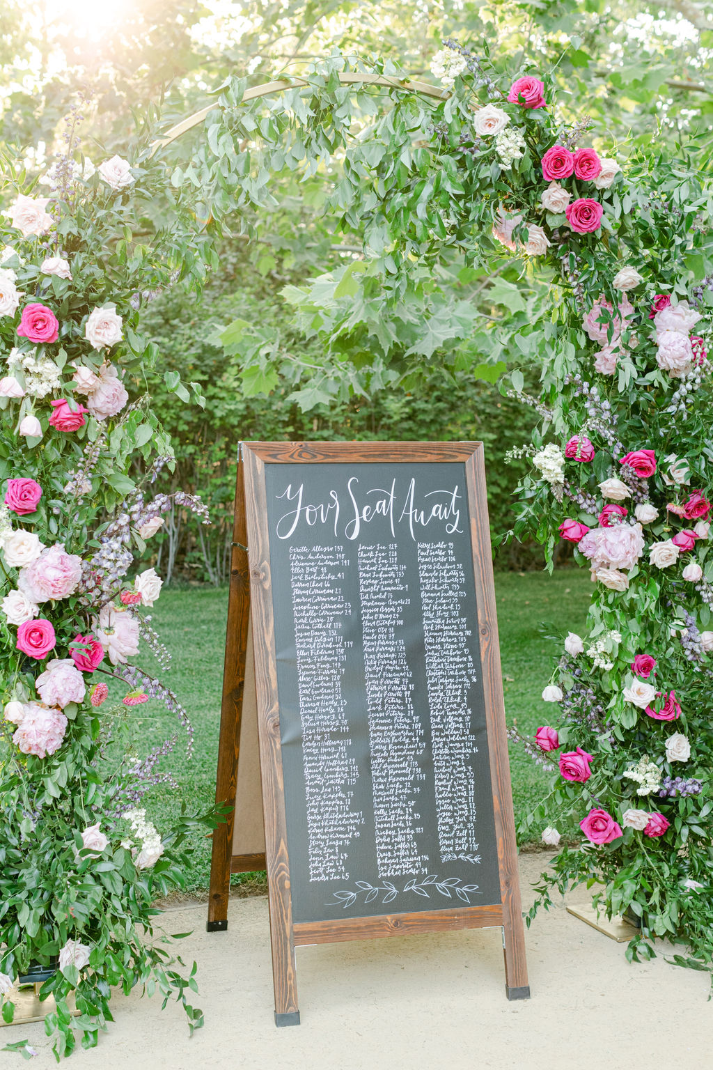 Seating chart framed in climbing roses