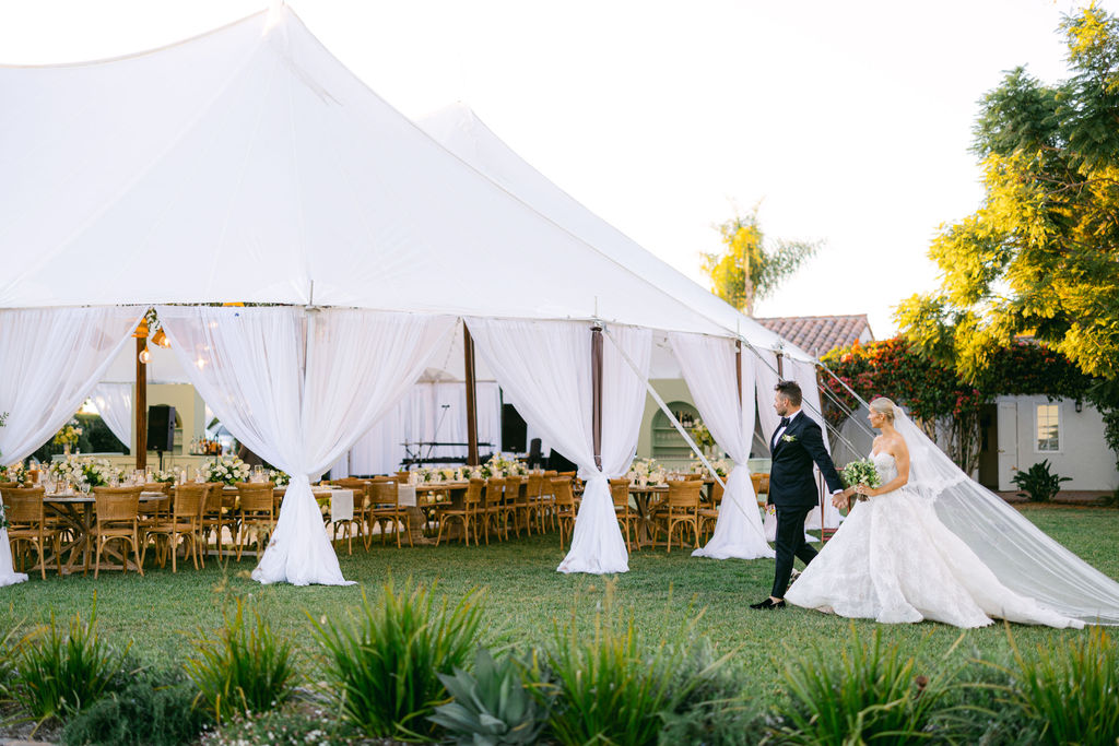 Long tables and candlelight under the tent