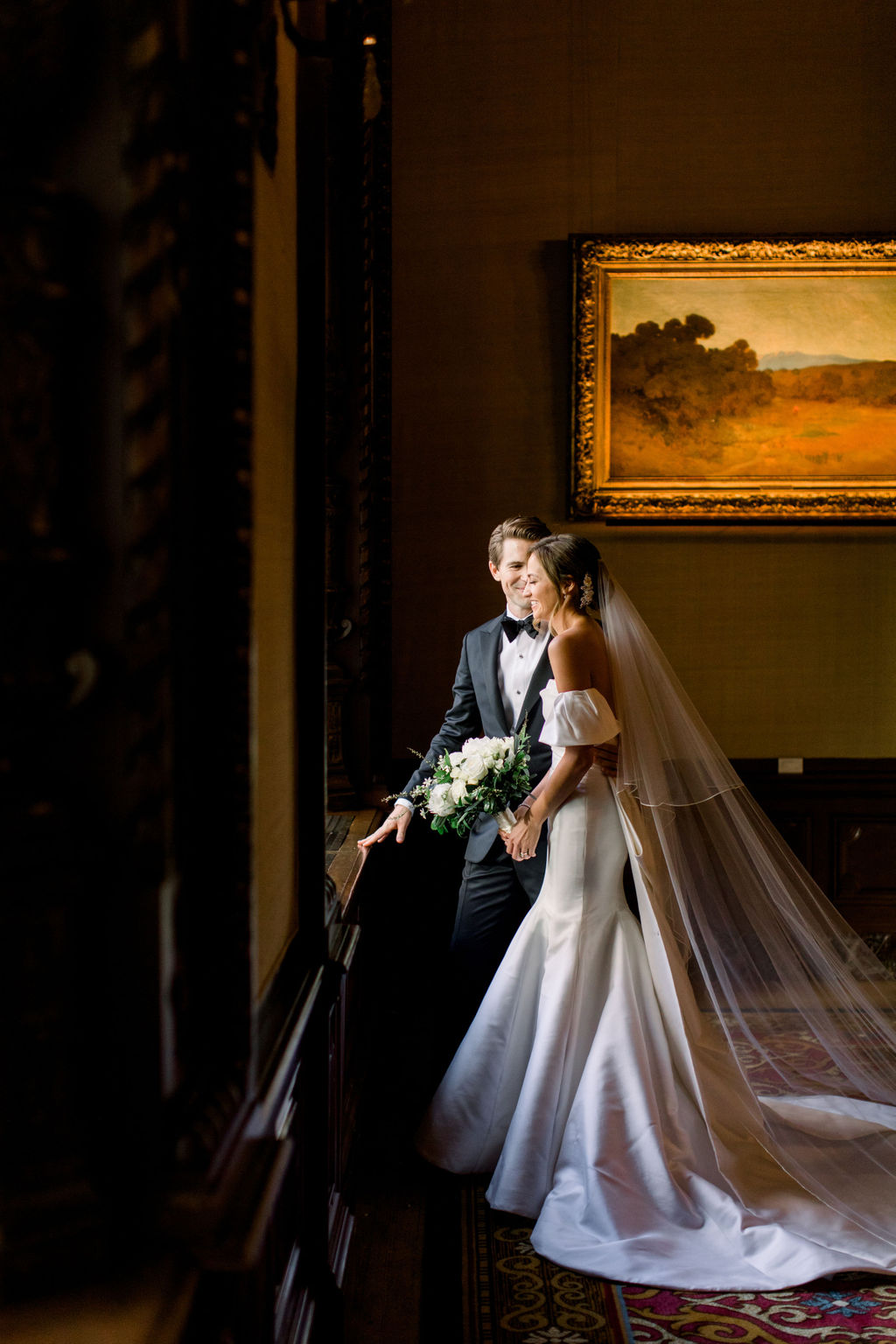 Bride in the window bay at the Jonathan Club, downtown Los Angeles beyond