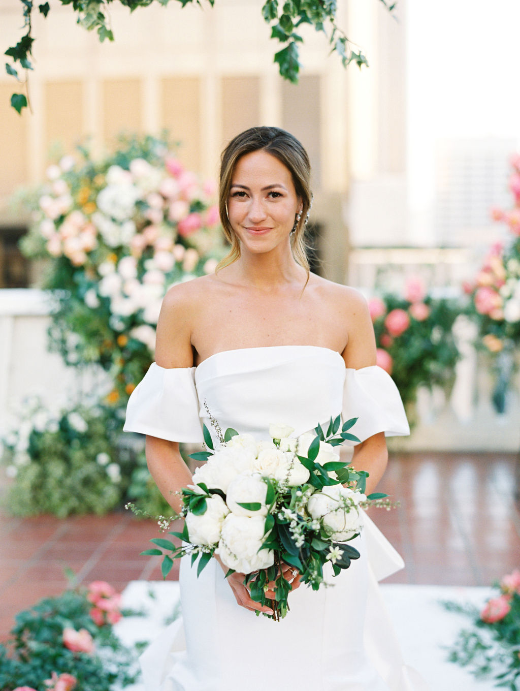 Laughing among peonies and garden roses