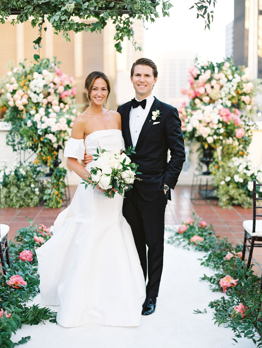 The groom at the flower wall