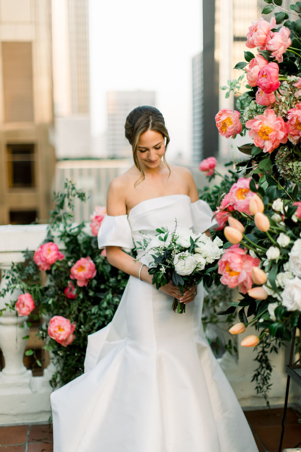 Among the coral peonies
