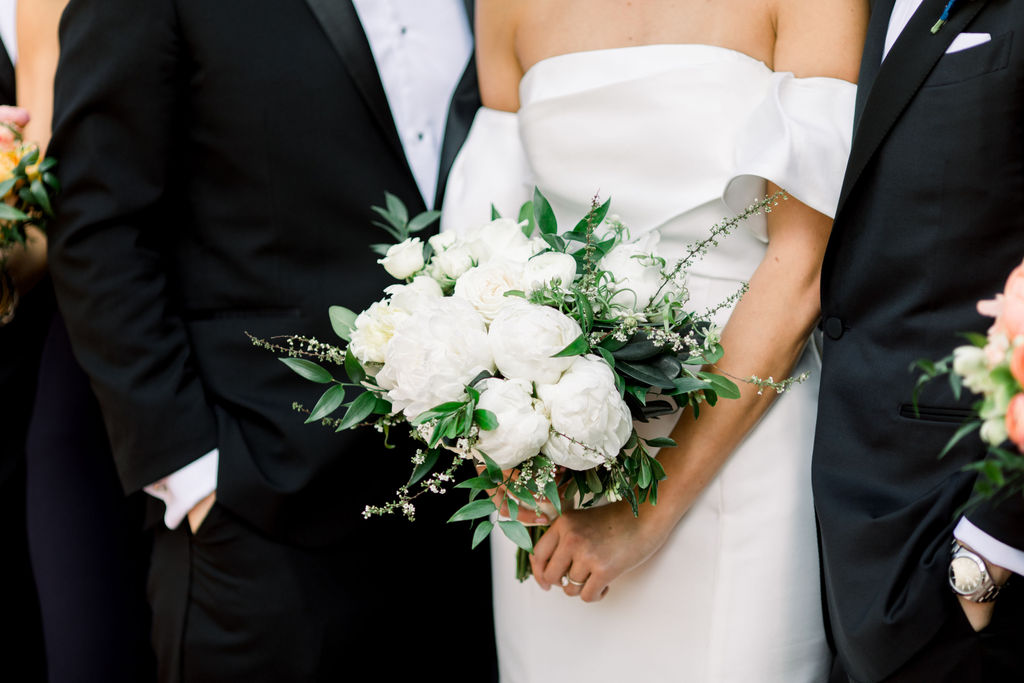 Cathedral veil with bridesmaids in navy behind