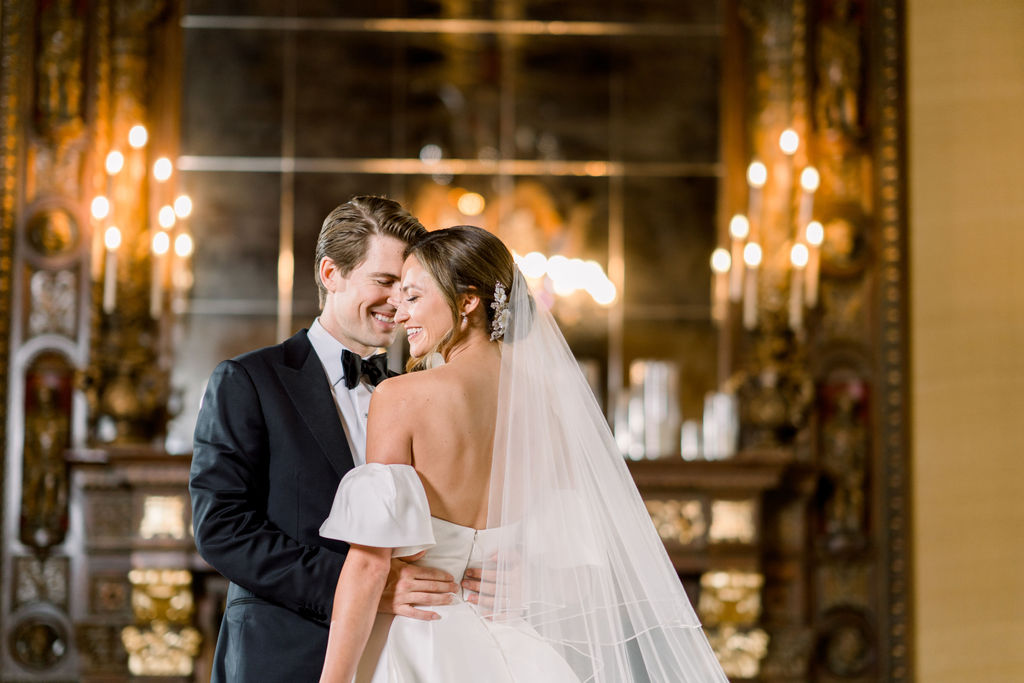 A kiss in the wood-paneled hall