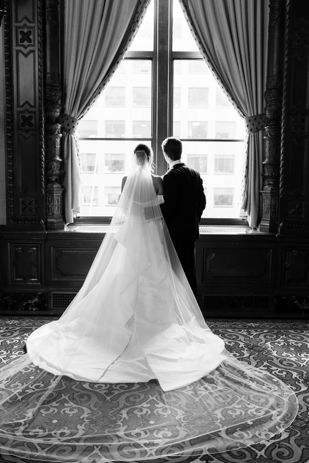 Window light falling across the gown