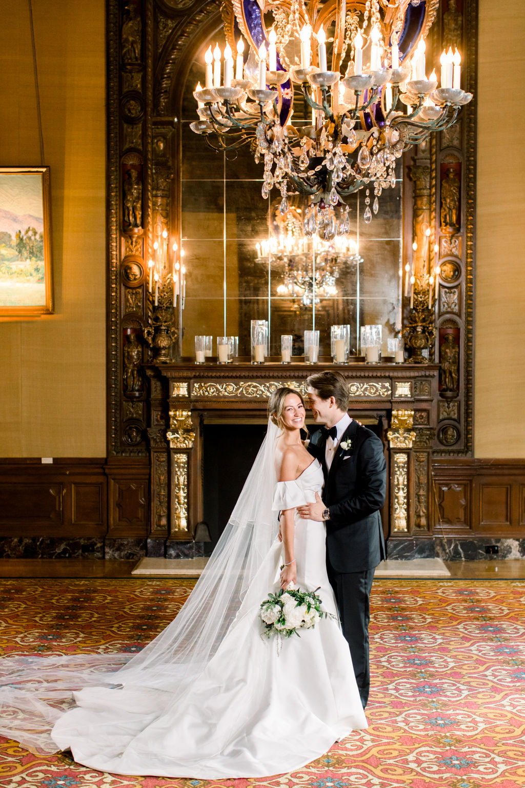 An embrace by the fireplace in soft, luminous light