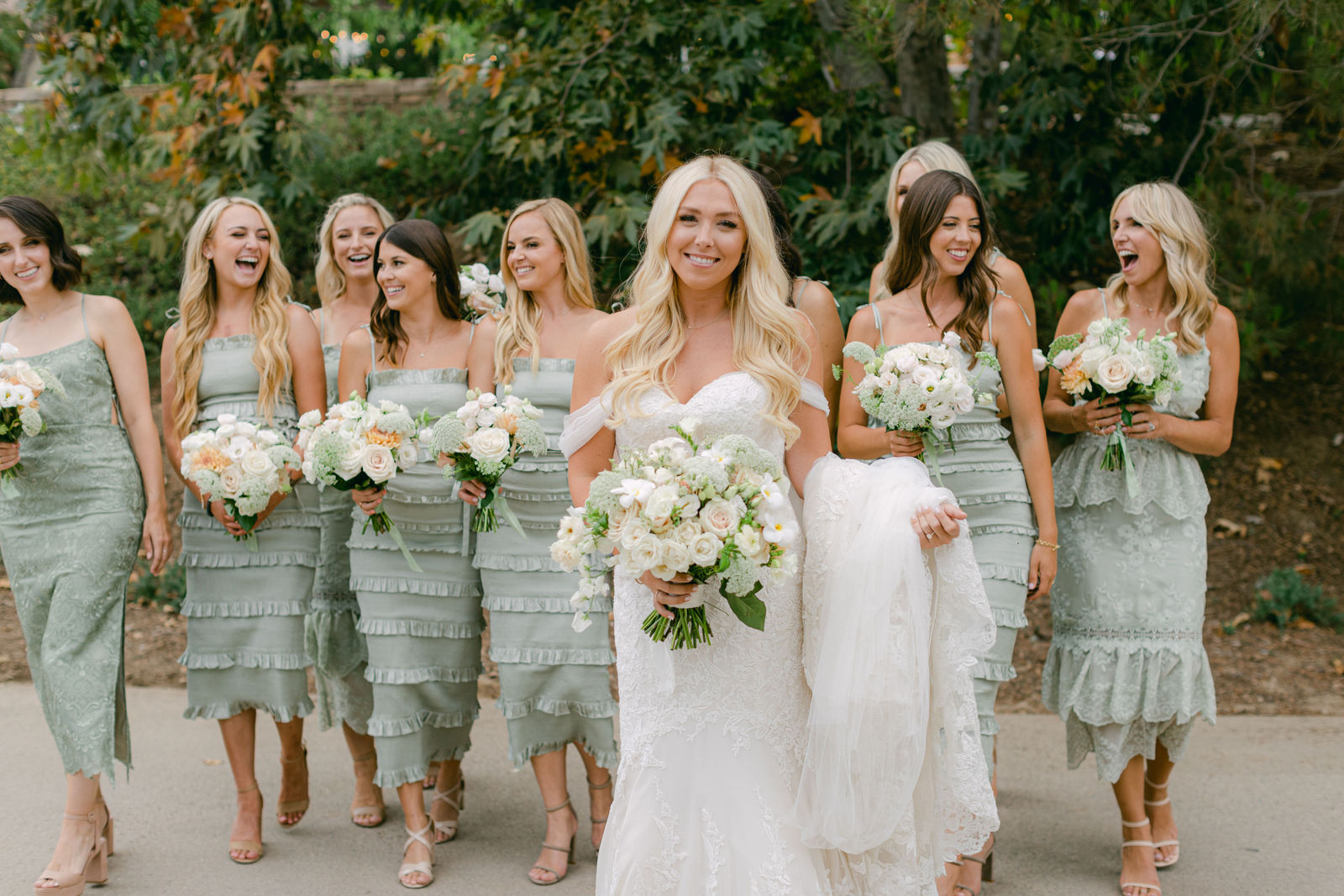 The bridal party in sage and black tie before the ceremony