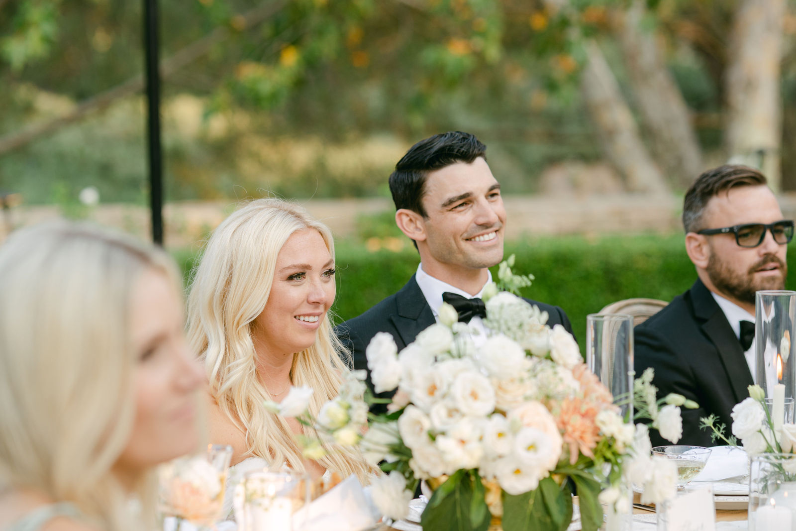 The first dance under the chandeliers, guests gathered around the floor