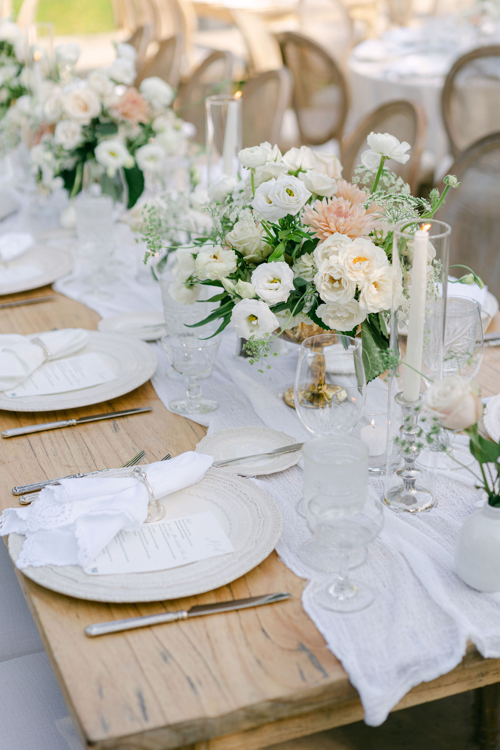 Florals and candlelight down the reception table