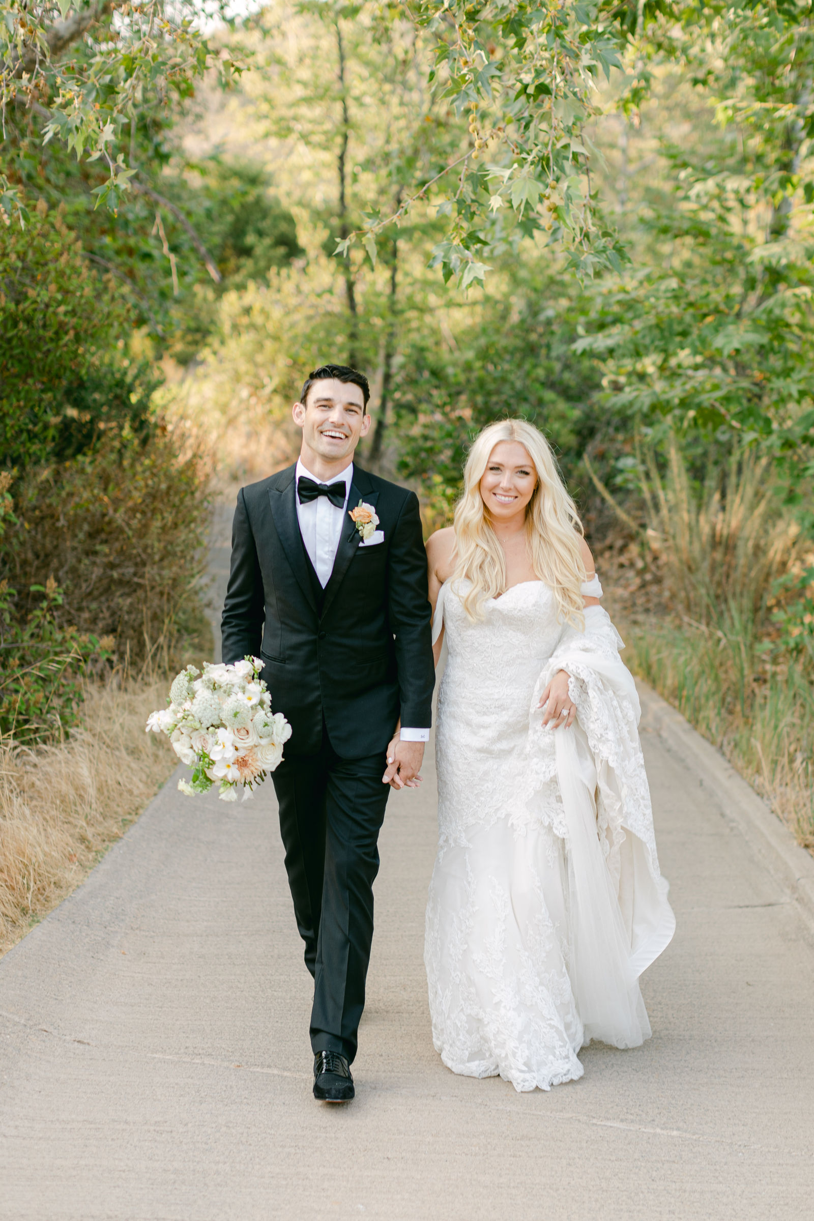 Shayna and Chance together on the path after the ceremony