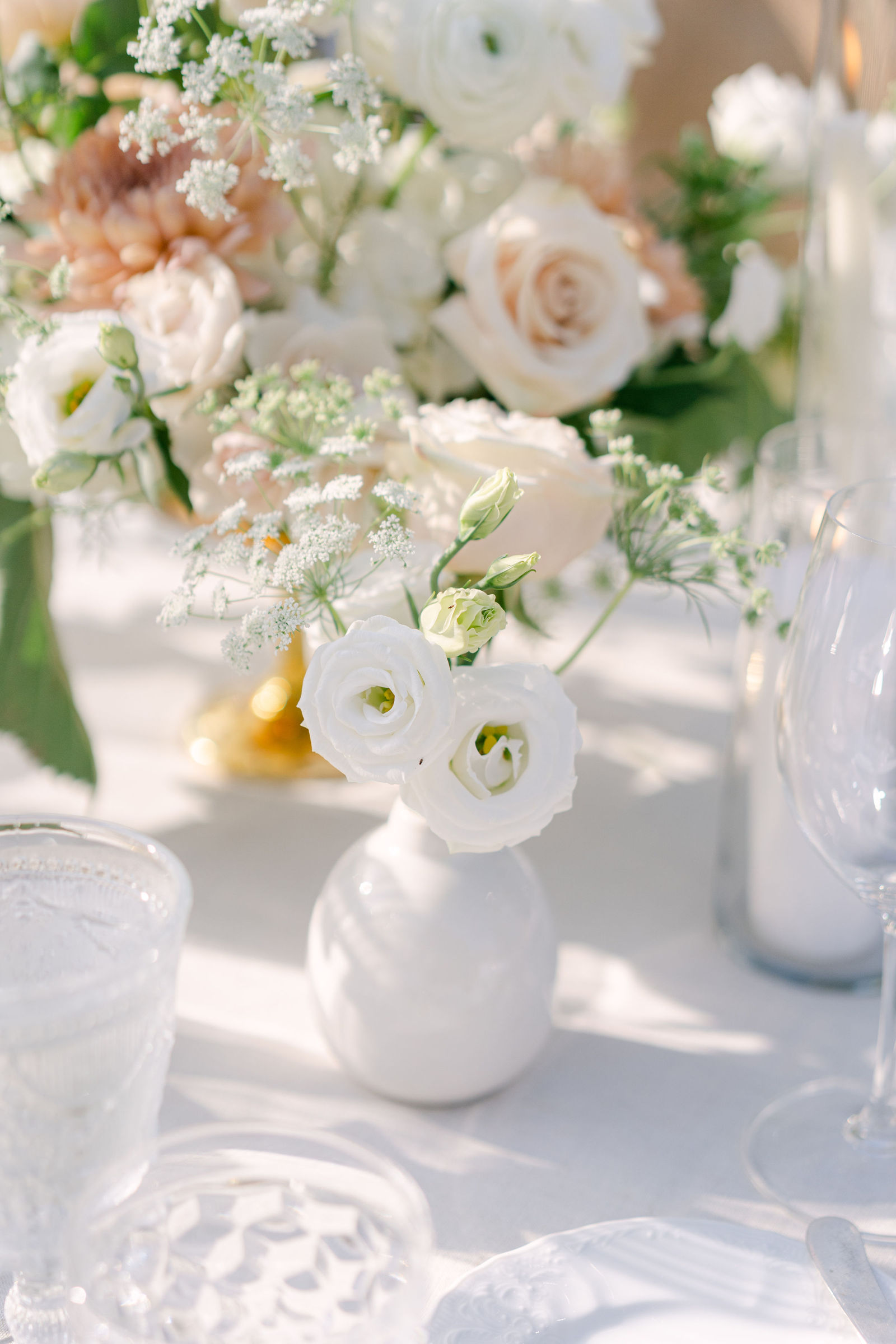Florals and candlelight down the reception table