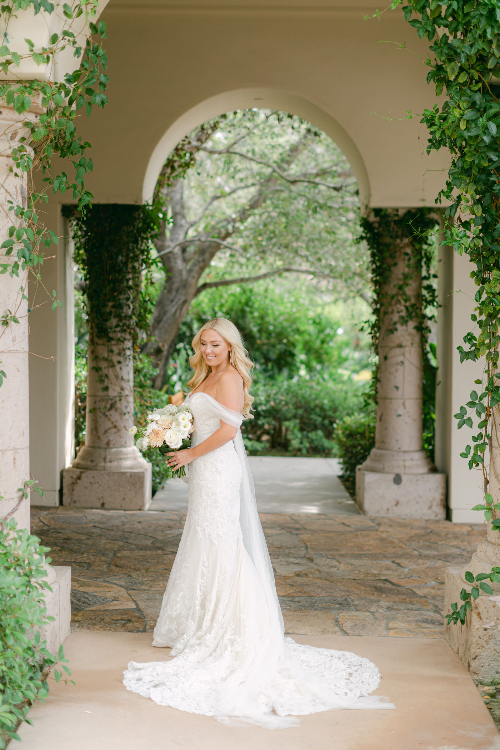 The ceremony set on the terrace at Shady Canyon Golf Club, white chairs in curved rows above the canyon