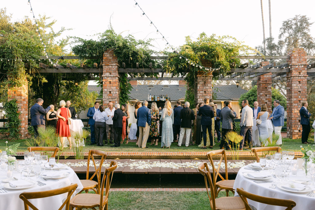 The welcome dinner table beneath the pergola