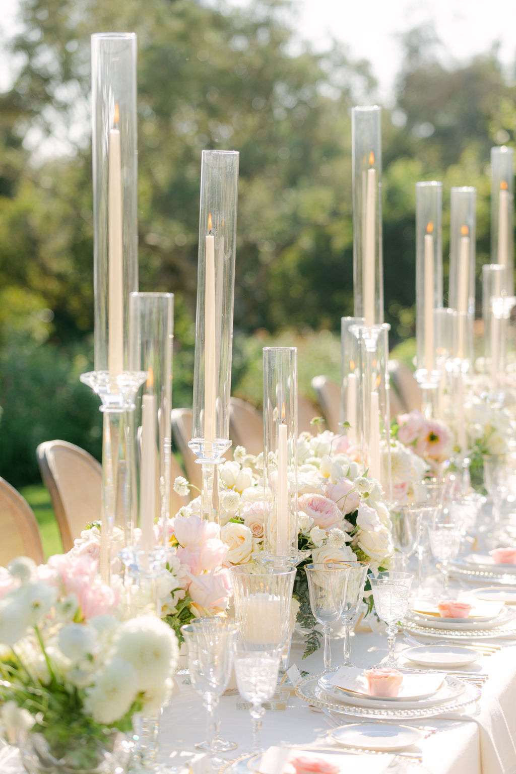 The reception tablescape at San Ysidro Ranch, florals and tapers down the length