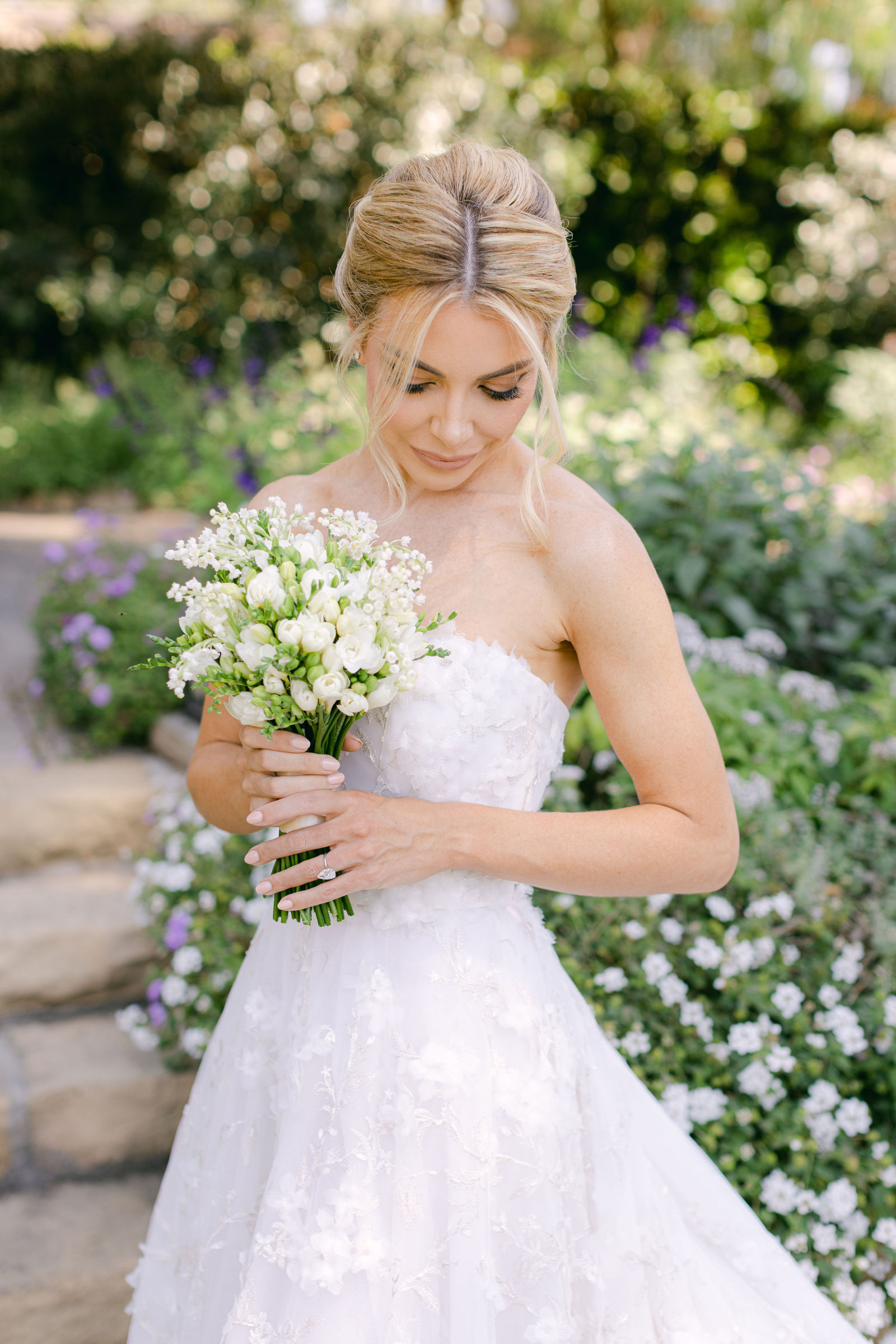 Lily of the valley and sweet pea in hand