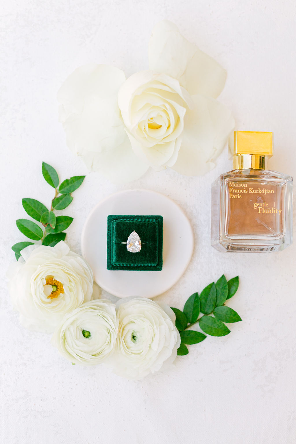 Perfume, ring and ranunculus
