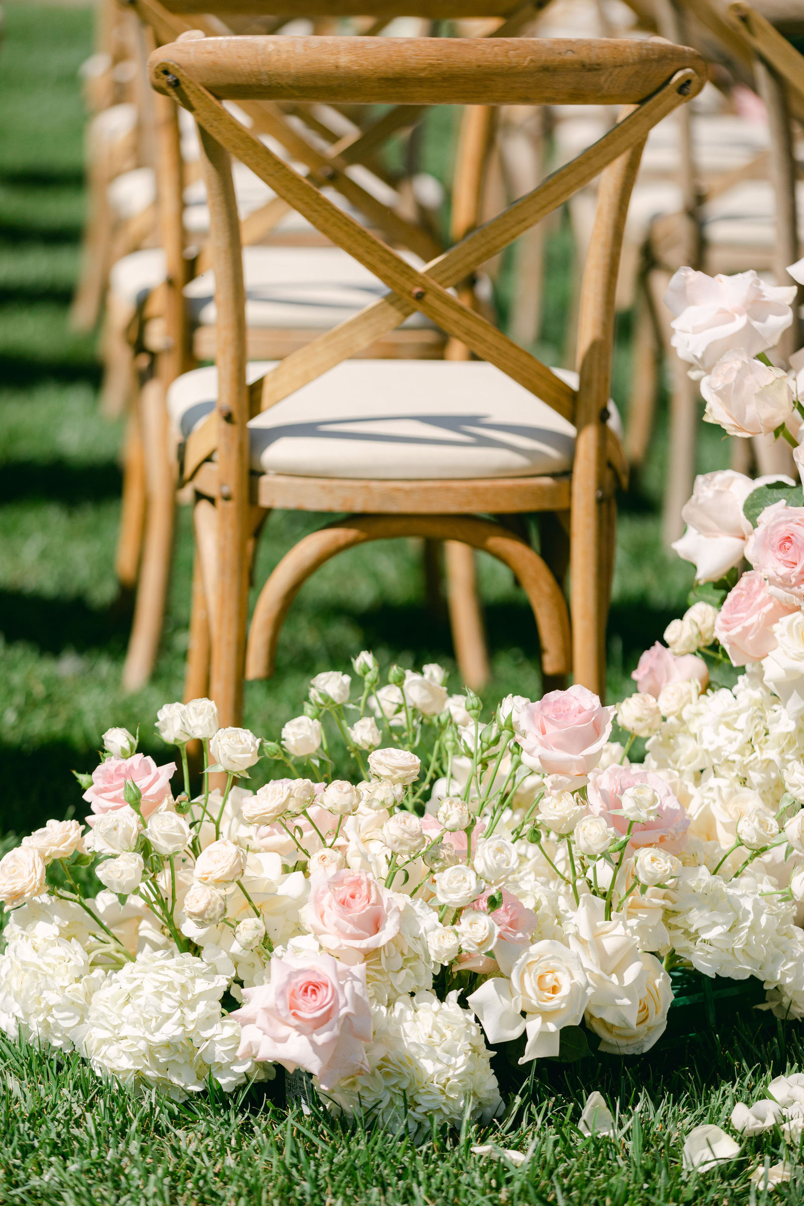 Roses at the feet of the cross back chairs