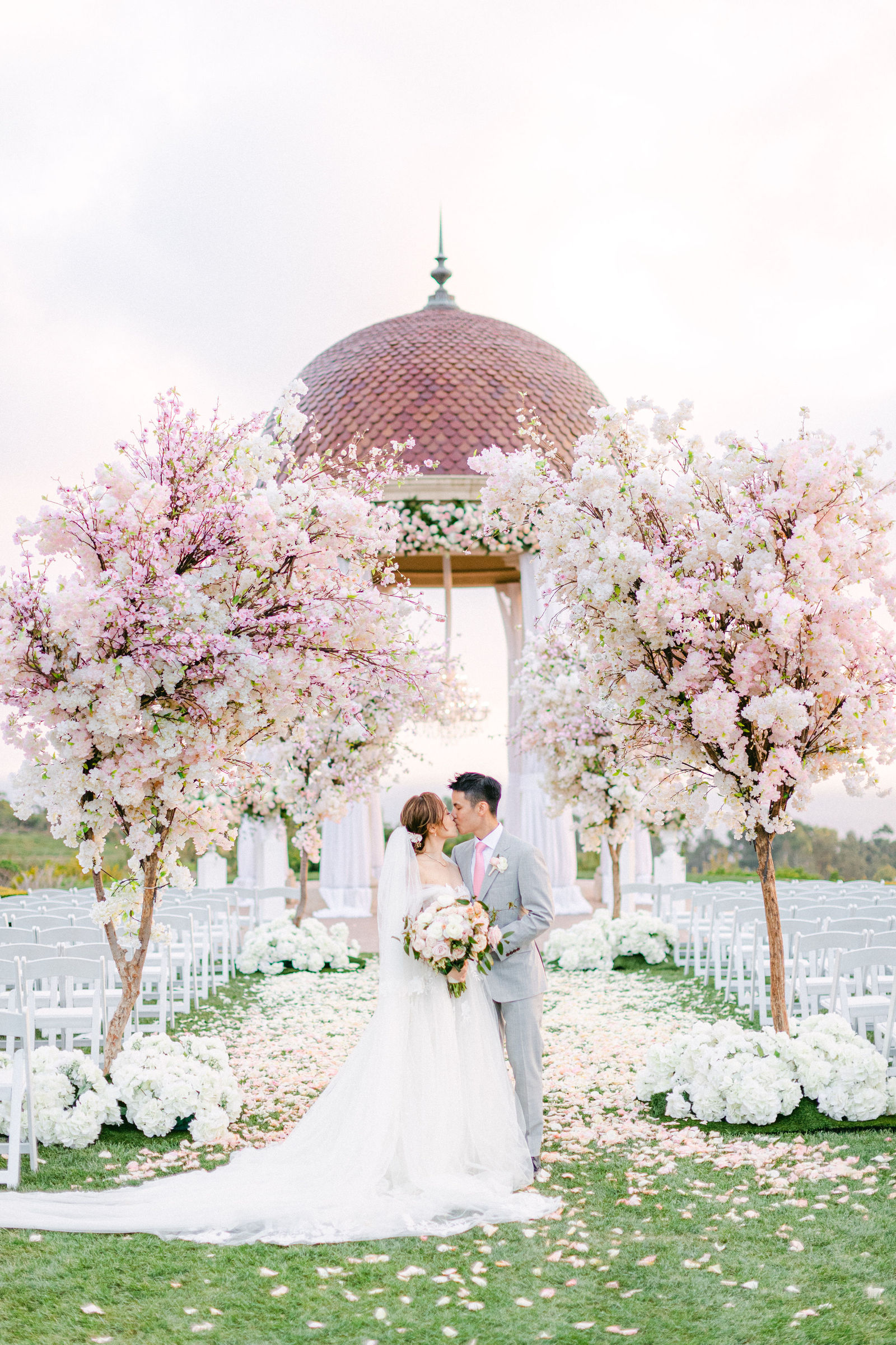 The kiss beneath the cherry blossom rotunda at The Resort at Pelican Hill