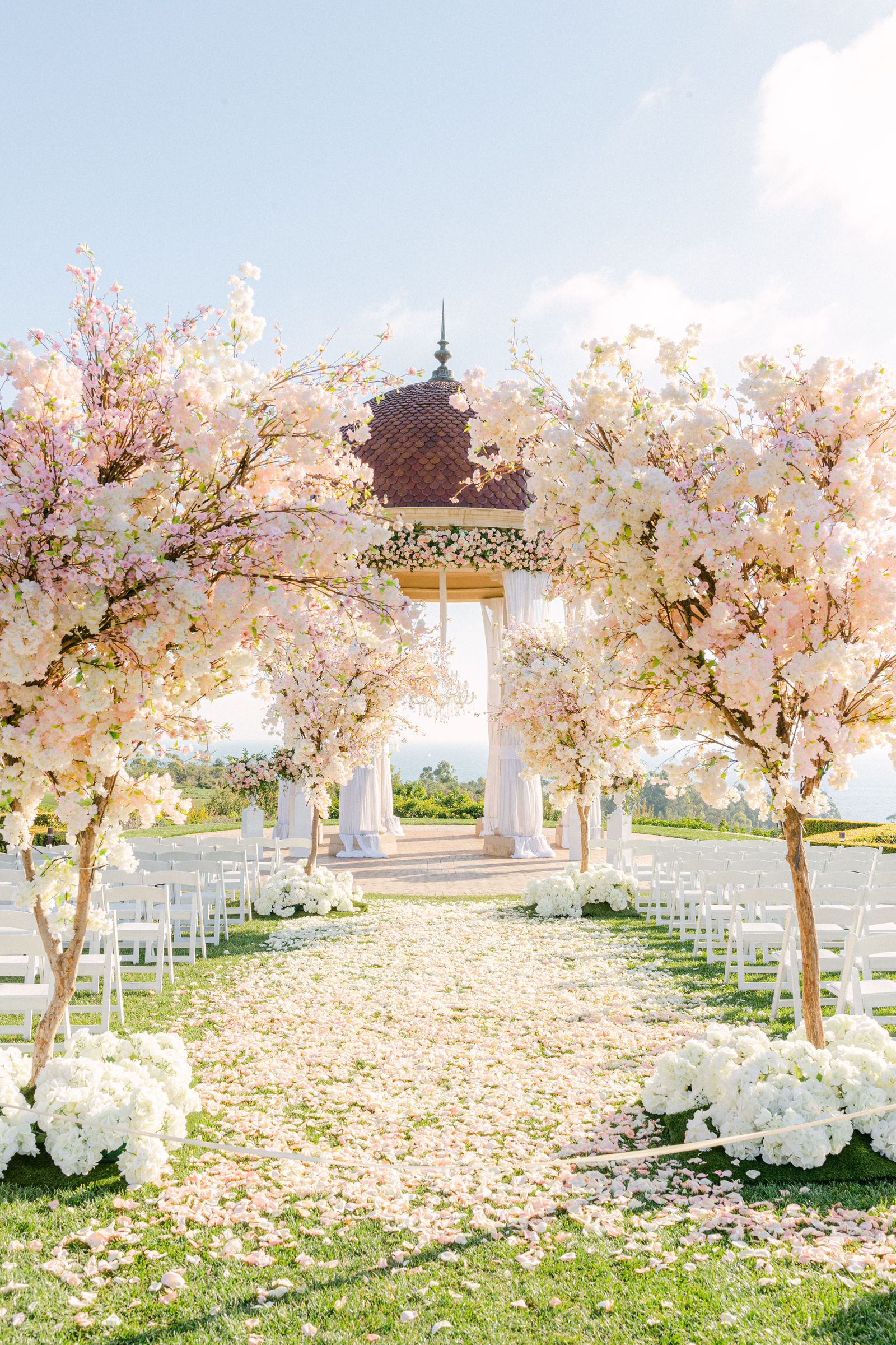 The rotunda framed by cherry blossoms above the Pacific