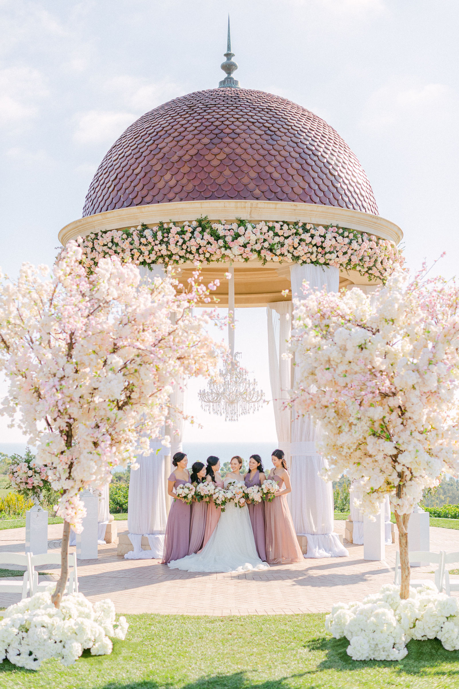 The rotunda dressed in blush, the wedding party beneath it